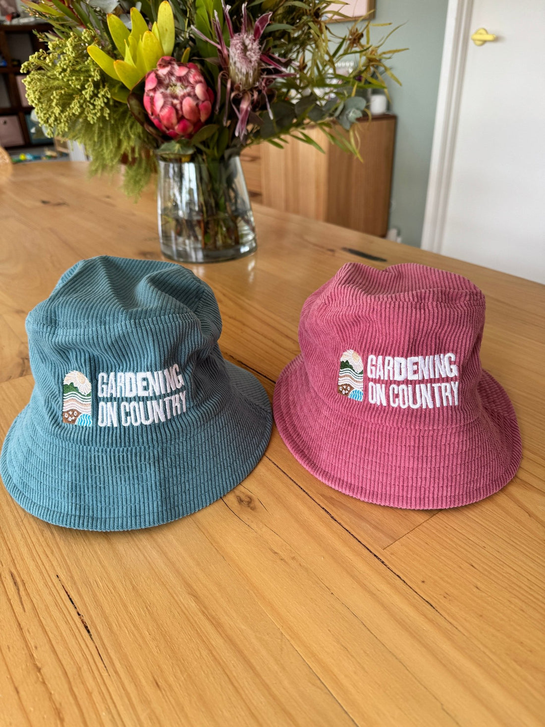 blue-pink-kids-size-bucket-hat-sun-protection-sitting-on-bench