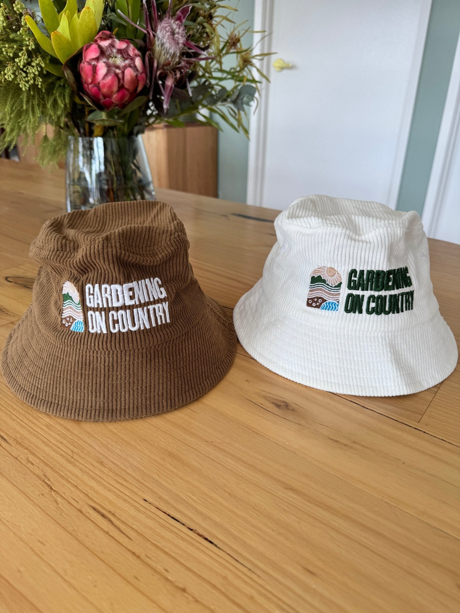 brown-white-kids-size-bucket-hat-sun-protection-sitting-on-bench