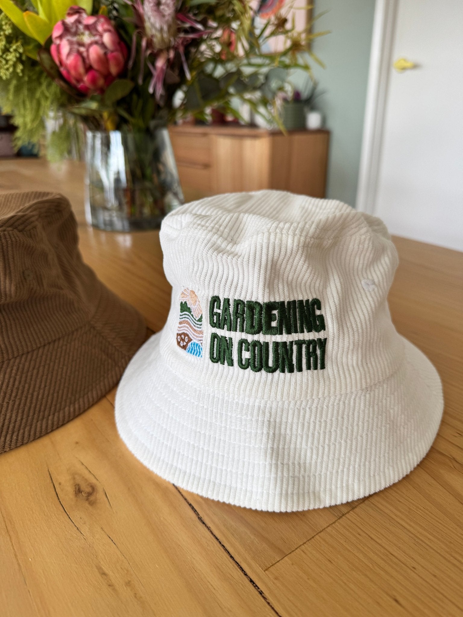white-kids-bucket-hat-cotton-sitting-on-bench