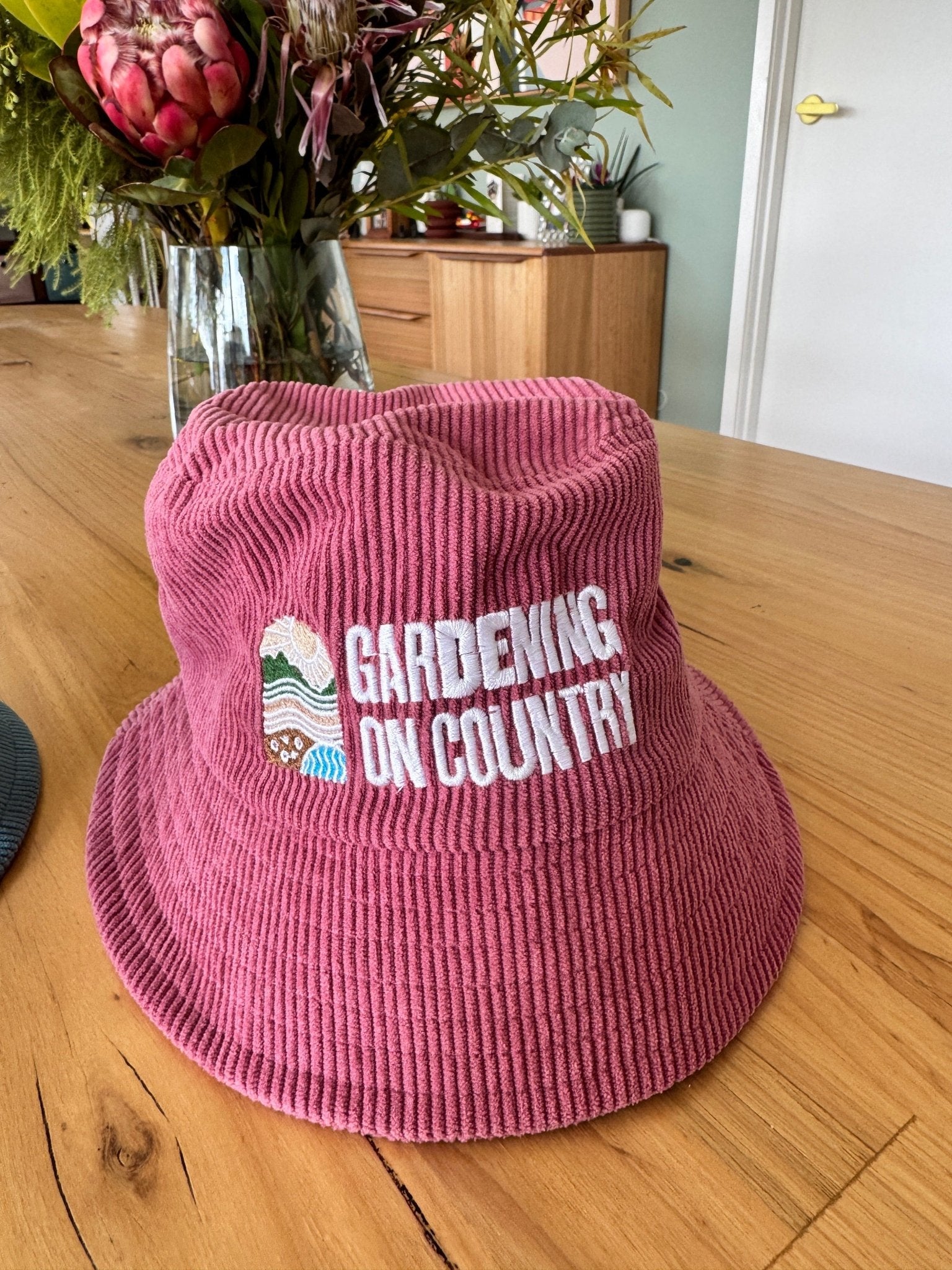 pink-kids-bucket-hat-cotton-sitting-on-bench