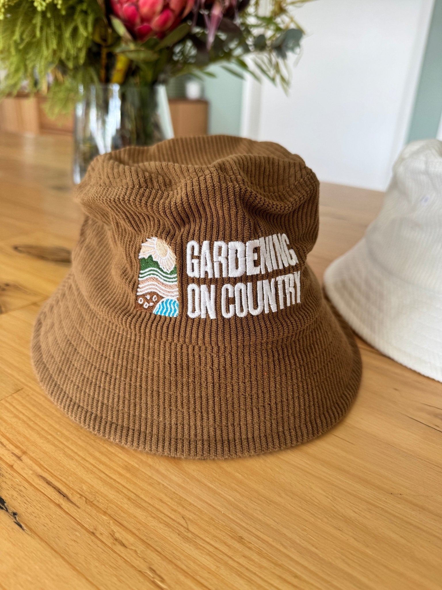brown-kids-bucket-hat-cotton-sitting-on-bench