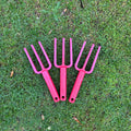 Group-photo-multicoloured-garden-hand-forks-on-grass