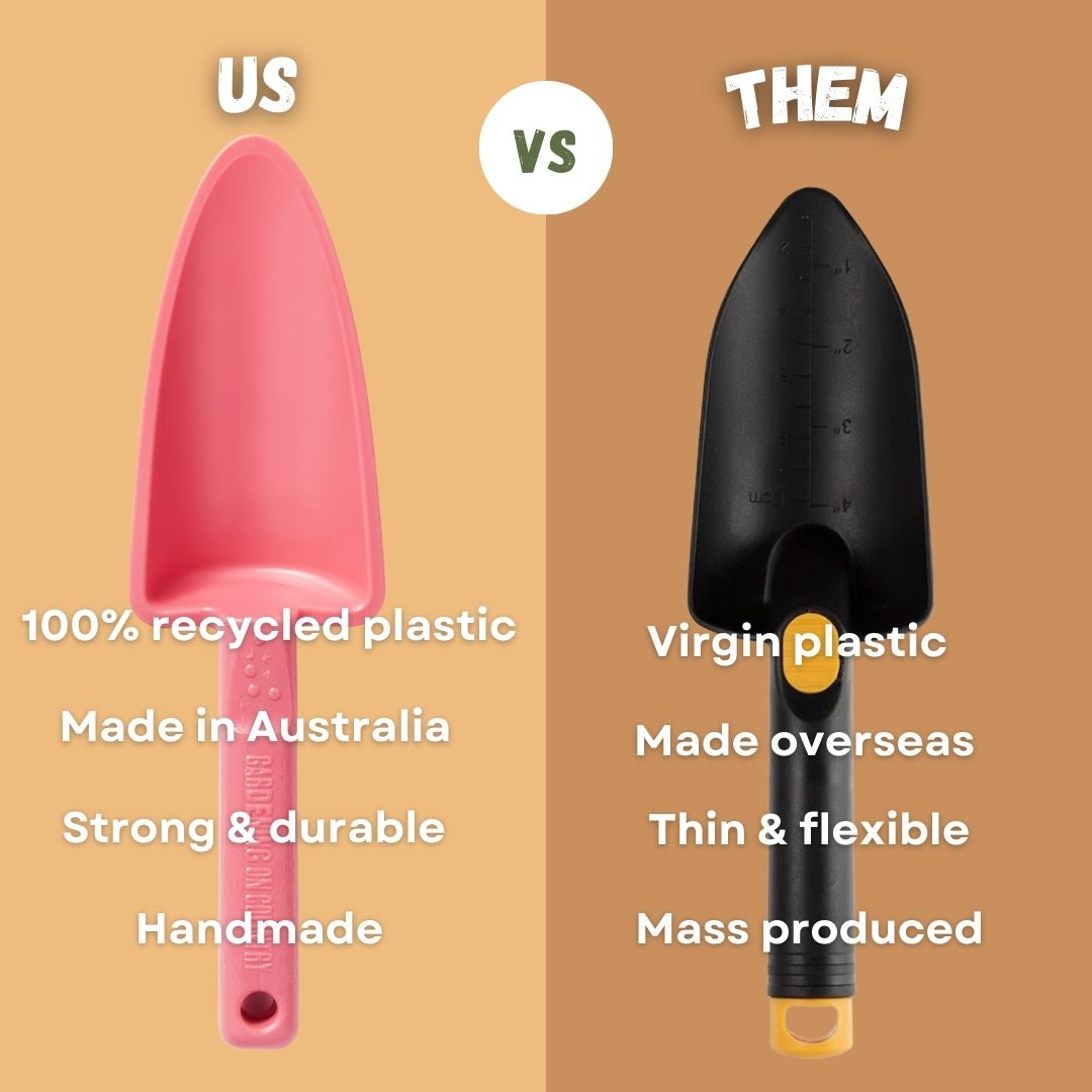 Comparison of a pink recycled plastic shovel labeled 'US' versus a black virgin plastic shovel labeled 'THEM' on a brown background.