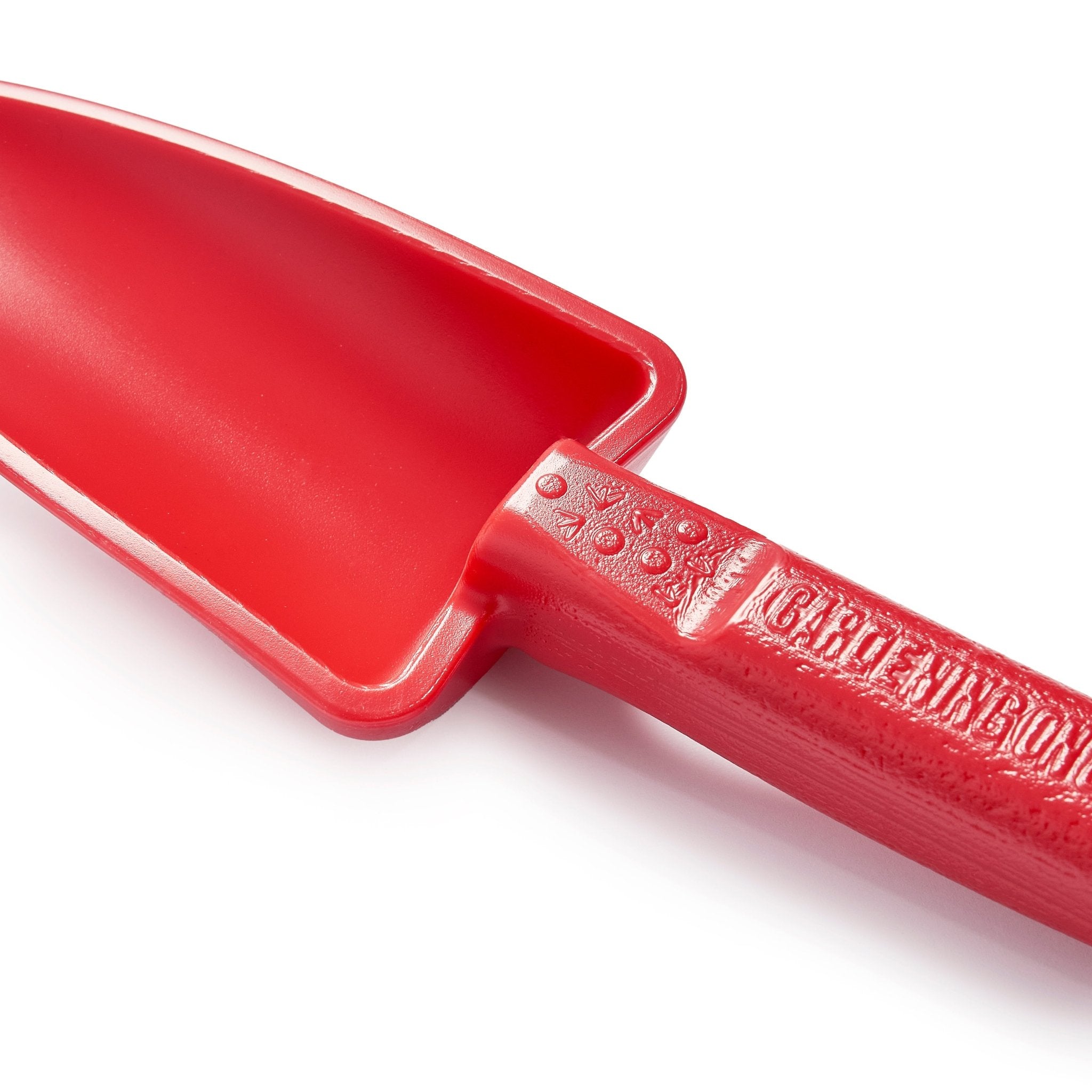 Red children's shovel with a white background