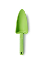 Green plastic garden shovel on a white background